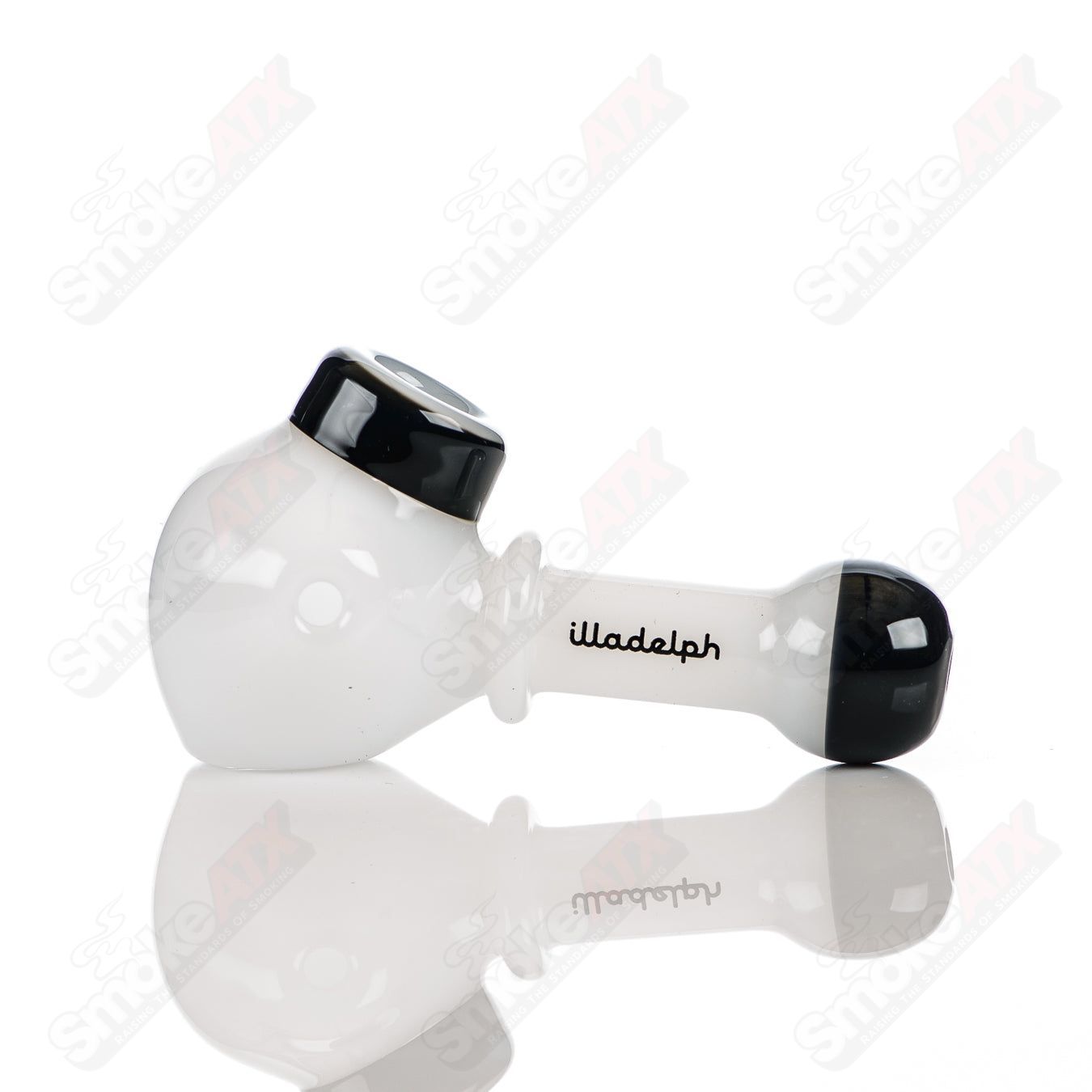 Illadelph glass multi-hole spoon pipe in white and black with multiple holes, designed for smooth smoking experience.