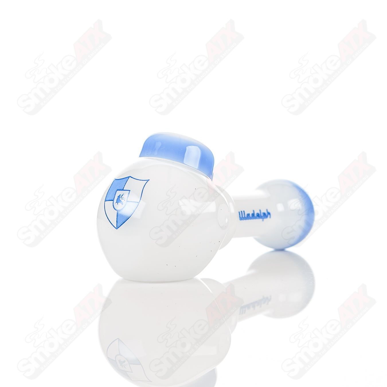 Illadelph white and blue glass multi-hole spoon pipe with multiple air holes for smooth smoking experience.