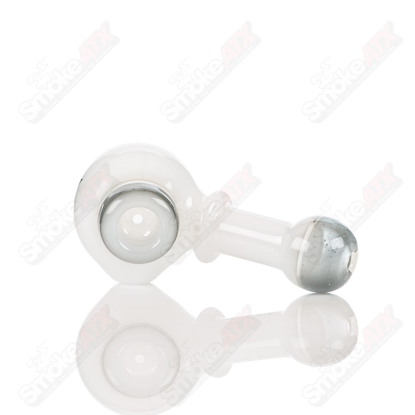 White and gray Illadelph glass multi-hole spoon pipe with multiple air holes, designed for smooth smoking experience.