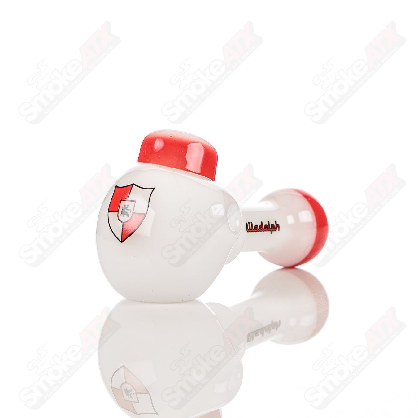 Illadelph glass multi-hole spoon pipe in white and red with multiple holes, designed for smooth smoking experiences.