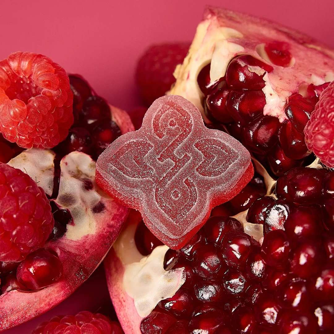 Hometown Hero 200mg Pomegranate Raspberry Delta-9 hemp edibles gummies with live rosin, vibrant fruit-flavored, natural ingredients.