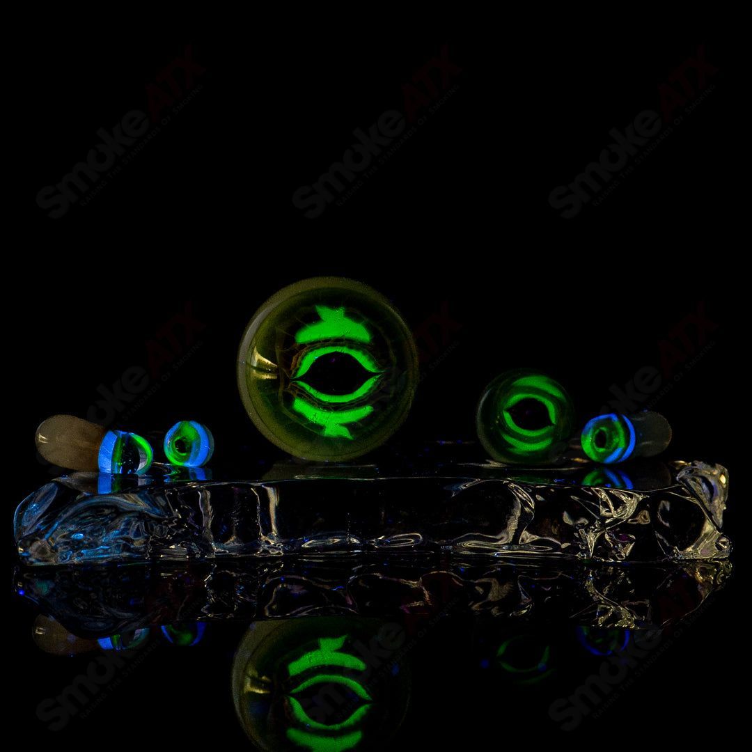 Indo Glass Dragon Eye Slurper Set featuring colorful glass tools for dabbing and concentrates.