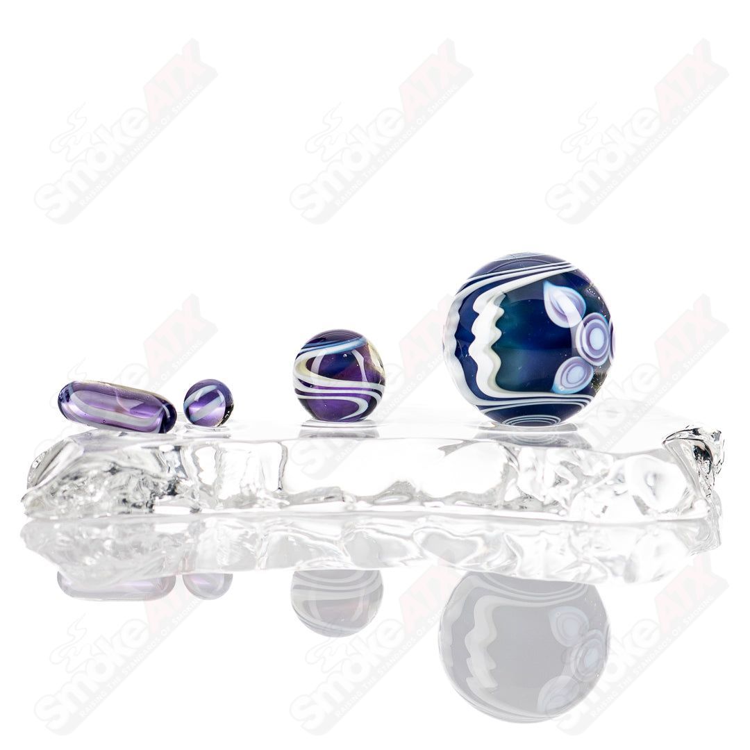 Indo Glass UV Dotstack Slurper Set with colorful glass tools and containers for immersive vapor experiences.