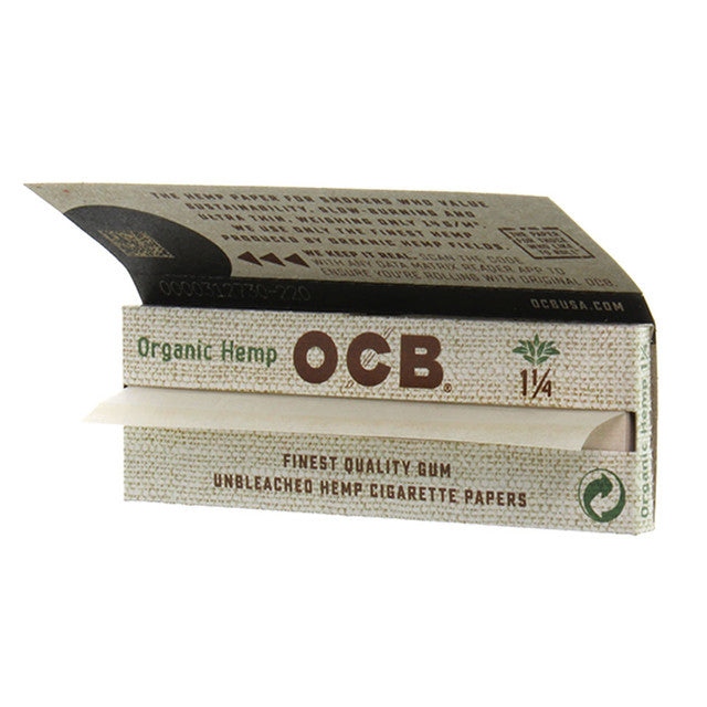 Organic hemp rolling papers by OCB, 1 1/4 size, shown in a natural, unrolled state with branding visible.
