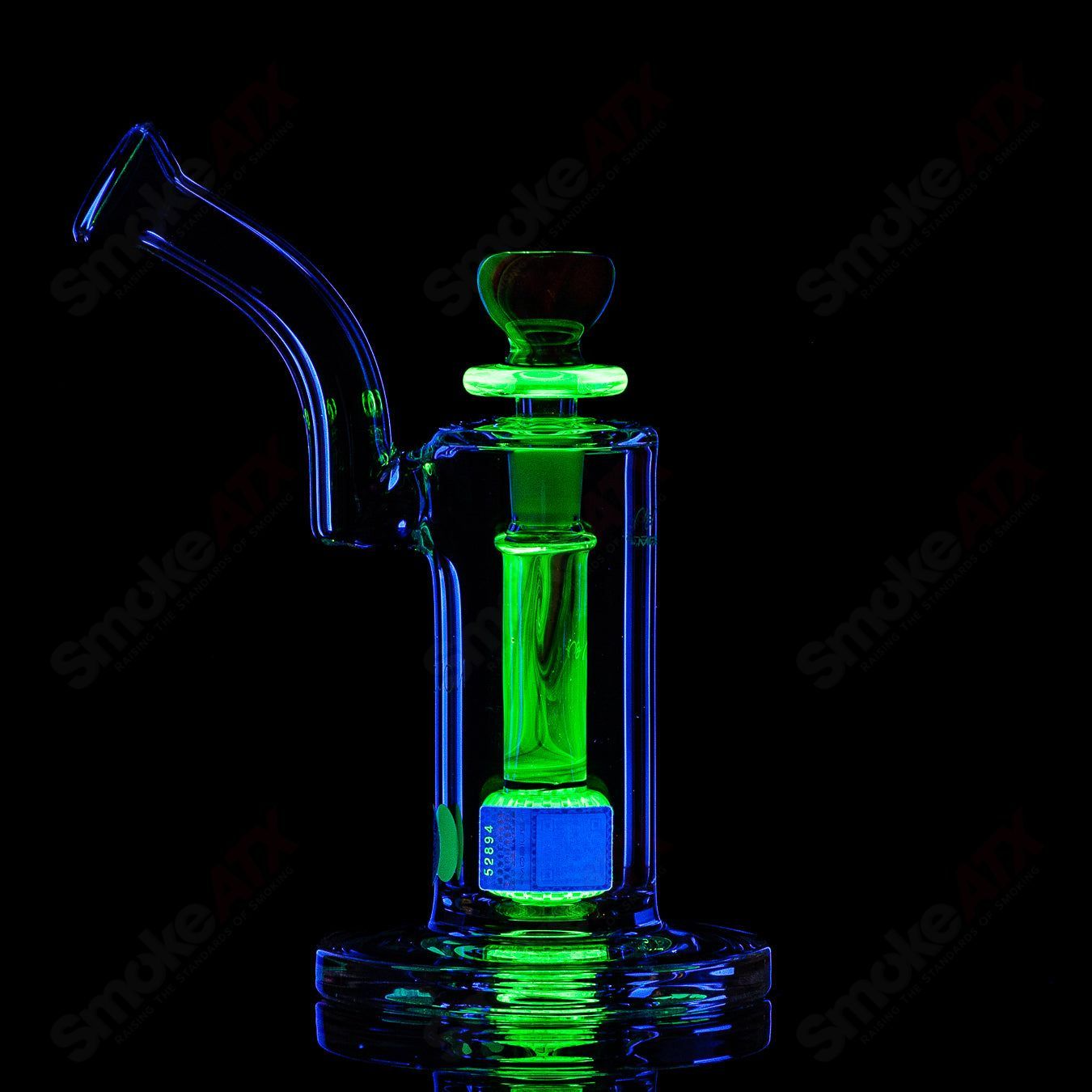 Mobius Nuc Accent Series glass bubbler with intricate design, clear glass body, and smooth mouthpiece for inhalation.