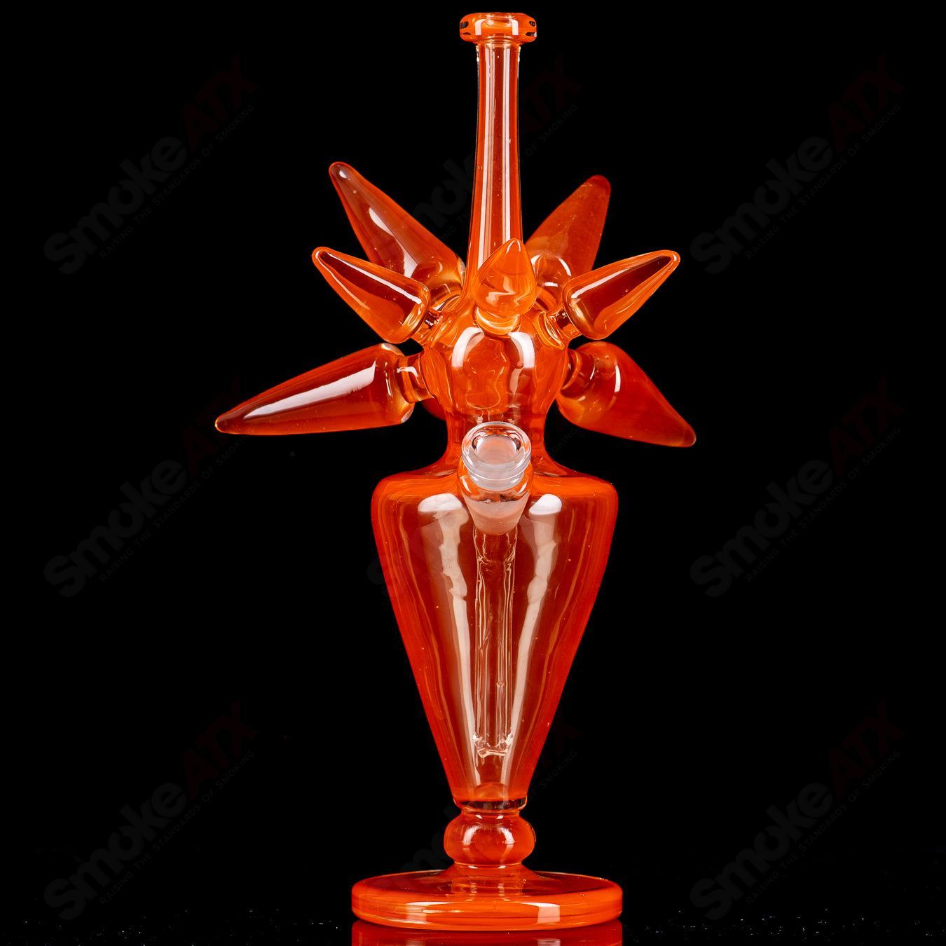 JMass OJ Spike Bottle Rig, heady glass concentrate rig with a spike-shaped design, featuring clear and colorful glass accents.