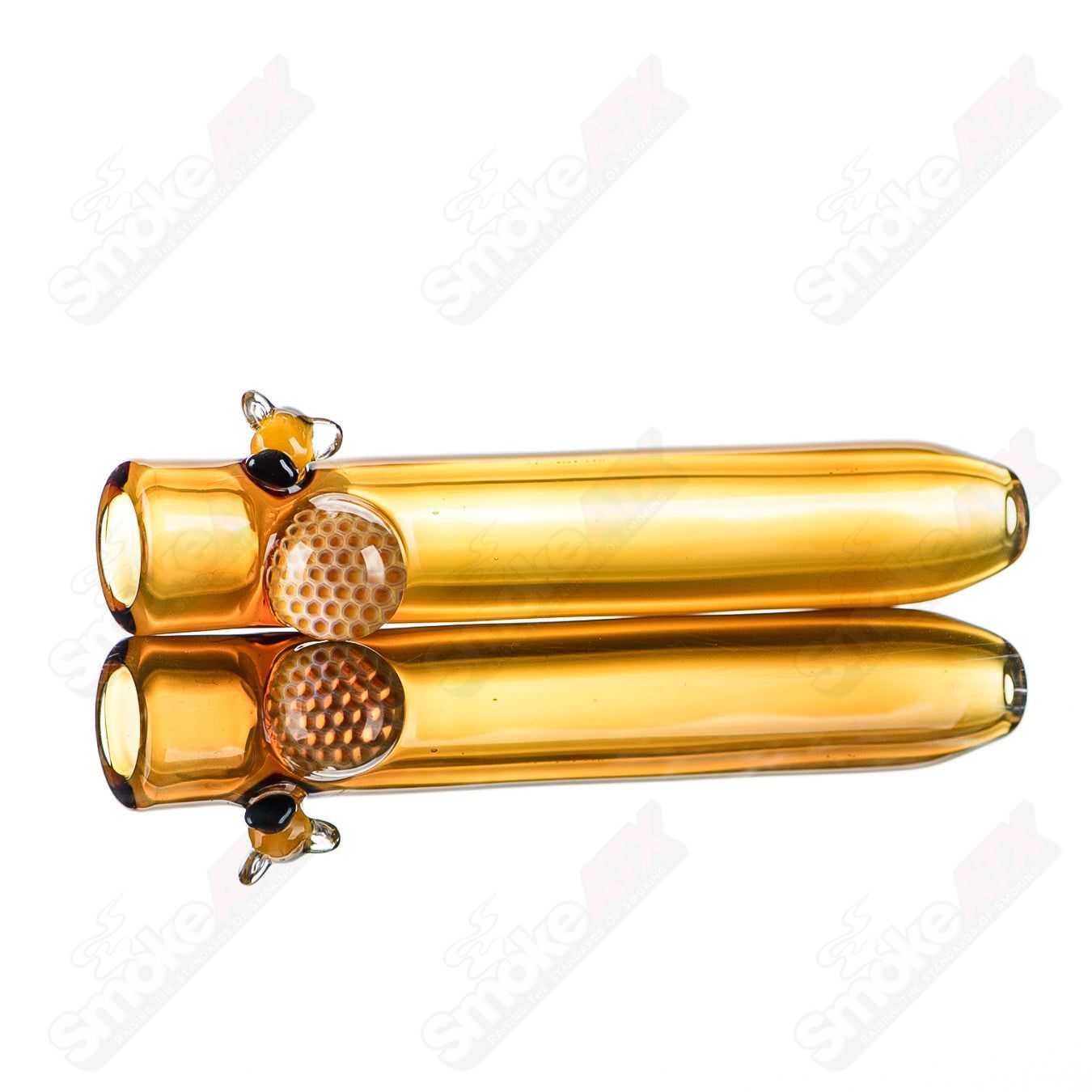 Joe P Glass honeycomb and bee chillum, heady glass one-hitter pipe with intricate honeycomb and bee design, detailed and colorful.