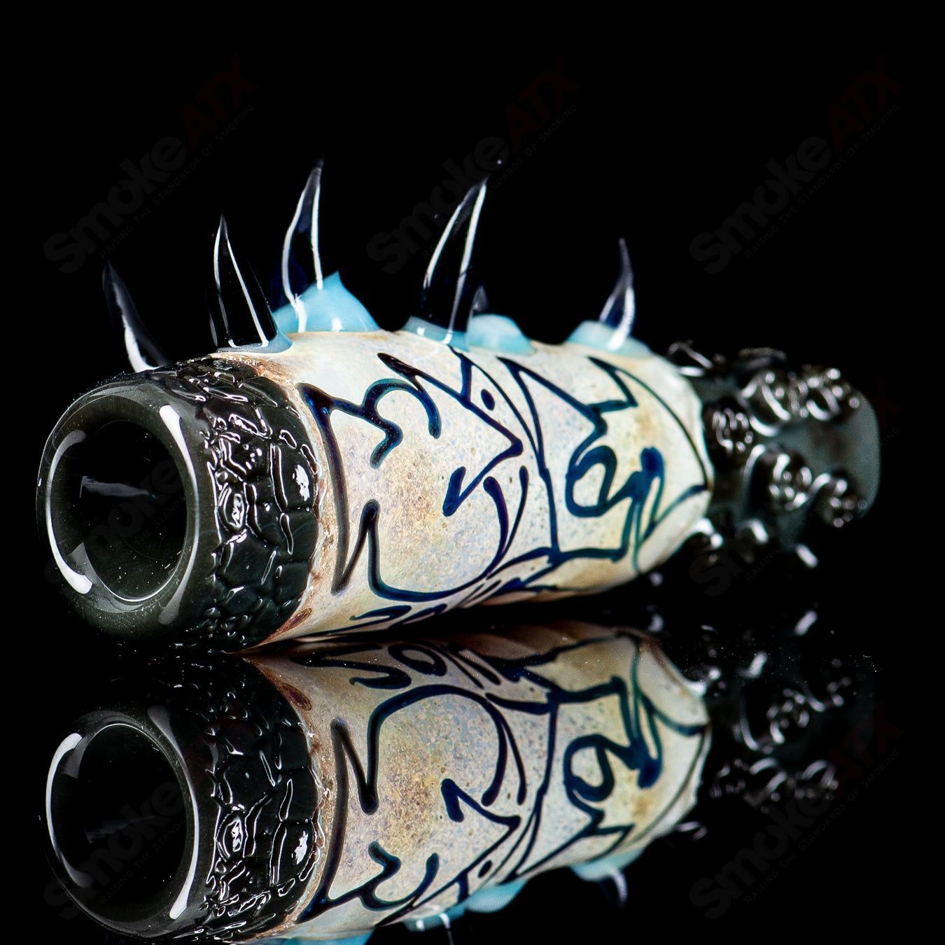 Salt Glass Onie signed 2014 heady chillum with vibrant glass design and intricate detailing.