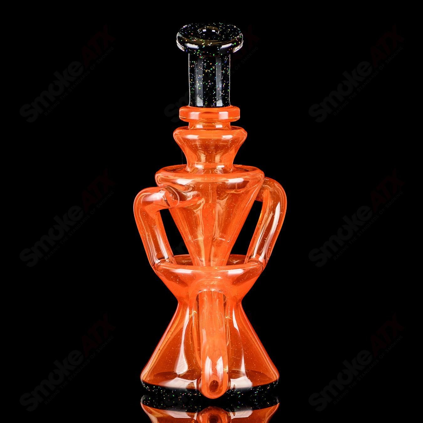 Orange and black crushed opal mini recycler concentrate rig by Captn Chronic, featuring intricate glass design and compact size.