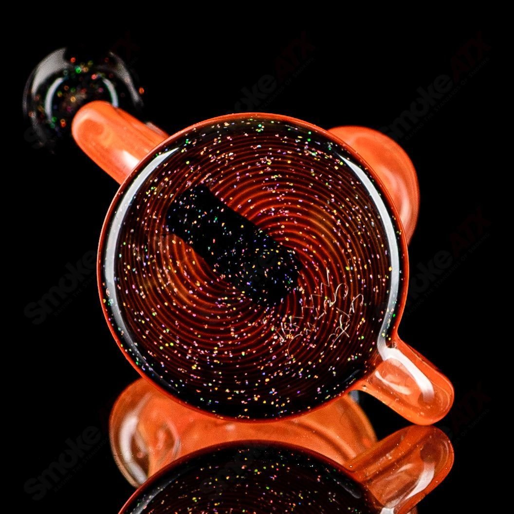 Orange and black crushed opal mini recycler rig by Captn Chronic, glass concentrate rig with vibrant design and intricate details.