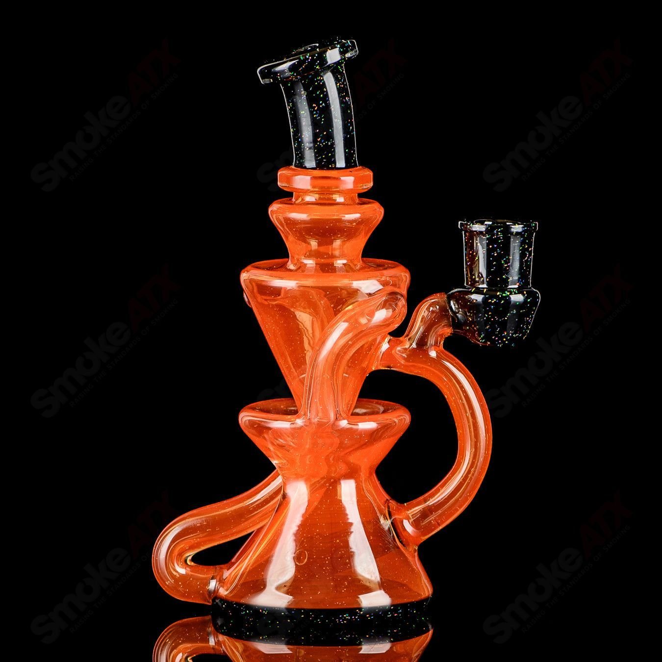 Orange and black crushed opal mini recycler concentrate rig by Captn Chronic, featuring vibrant glass design and intricate details.