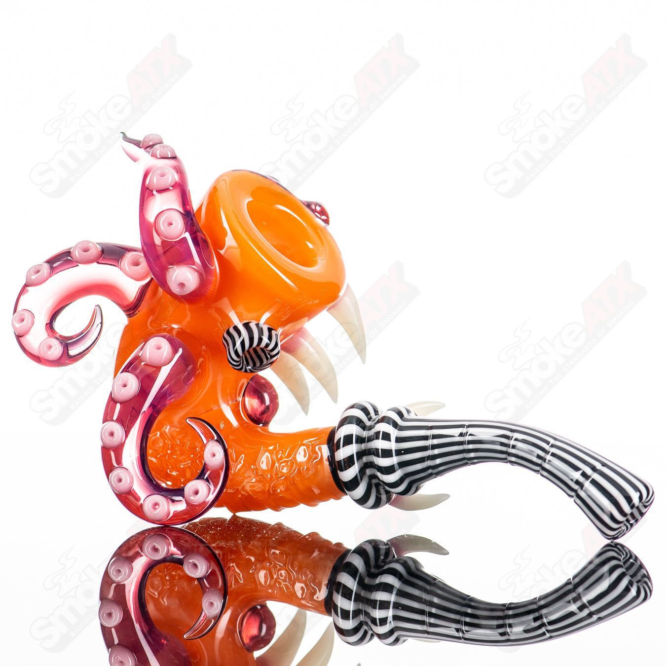 Orange Crayon Sherlock heady glass with black and white lines and telemagenta accents, crafted by Salt Glass.