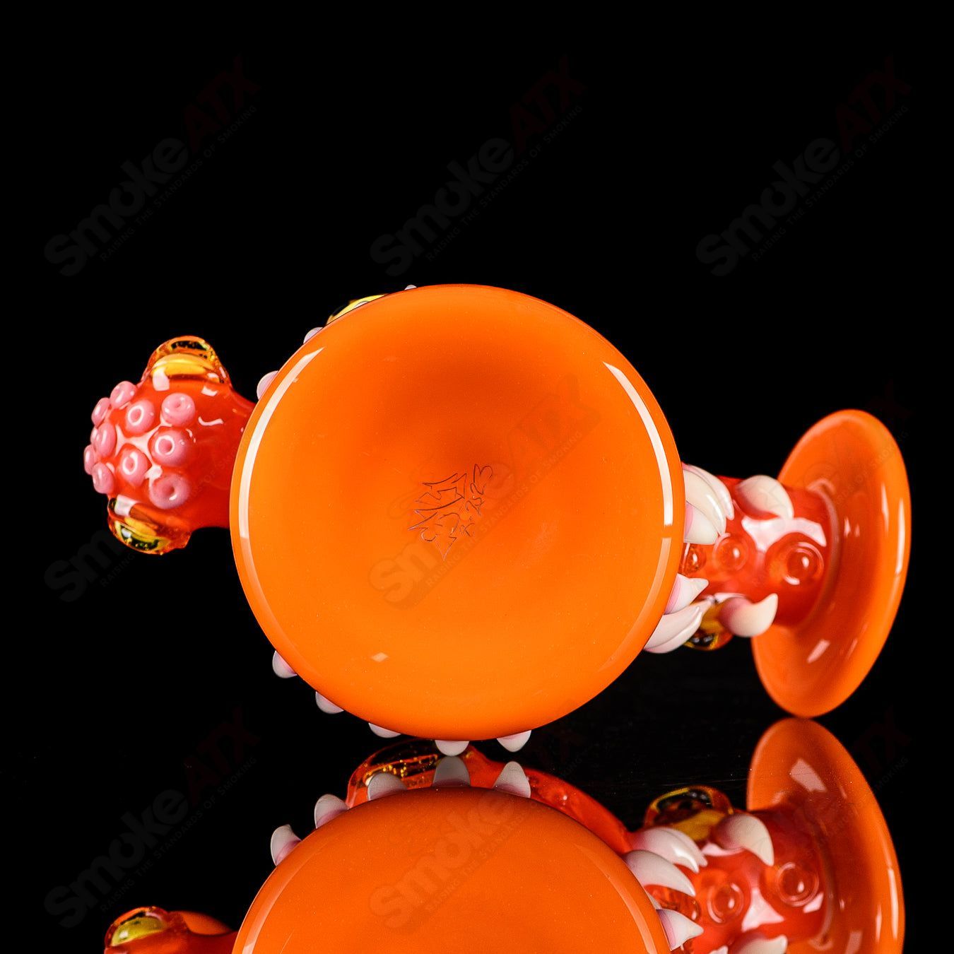 Orange Crayon Orb Rig by SALT & JAG, a colorful glass concentrate rig with a spherical design and vibrant orange accents.