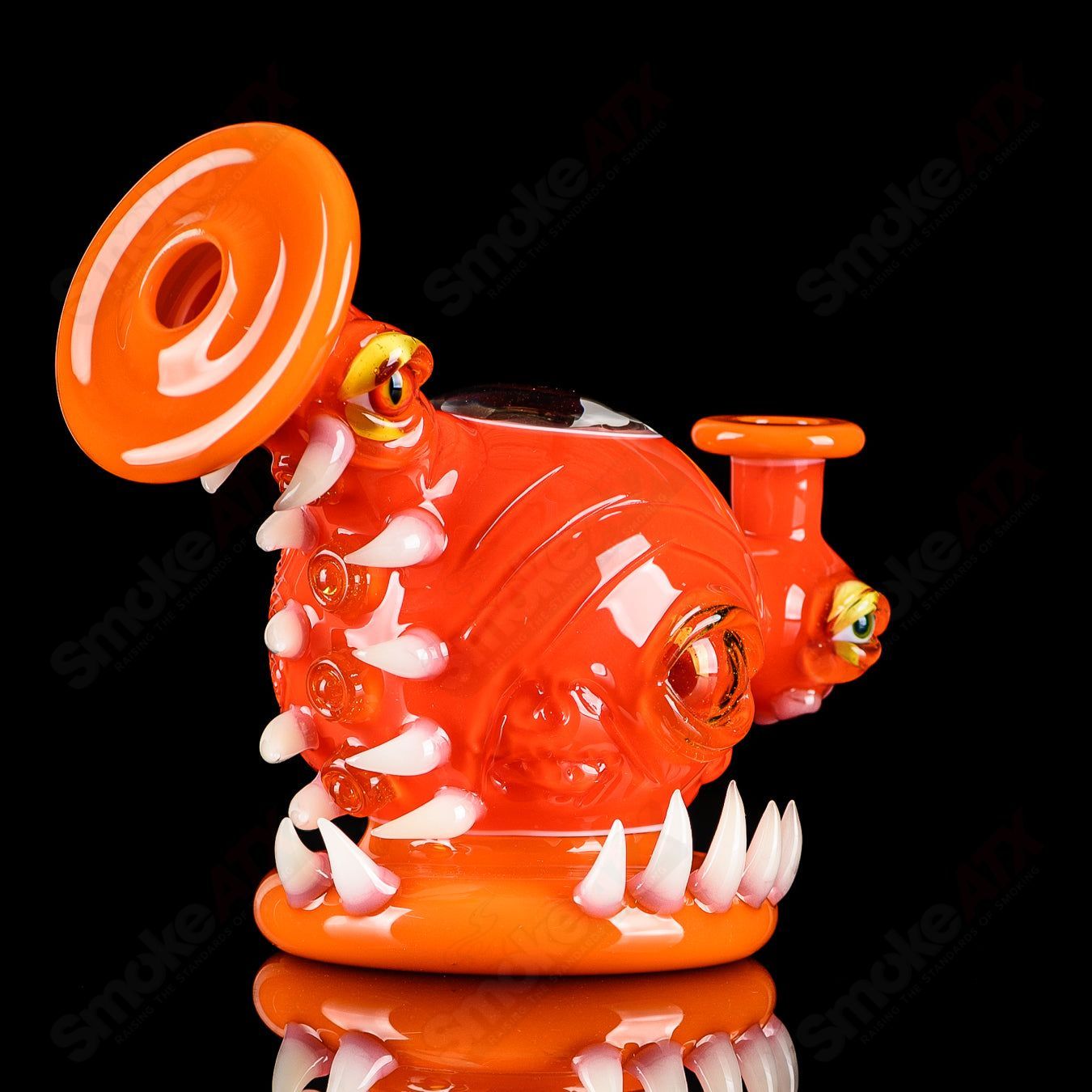Orange Crayon Orb Rig by SALT & JAG, a colorful glass concentrate rig with a spherical orb design for easy handling and aesthetic appeal.