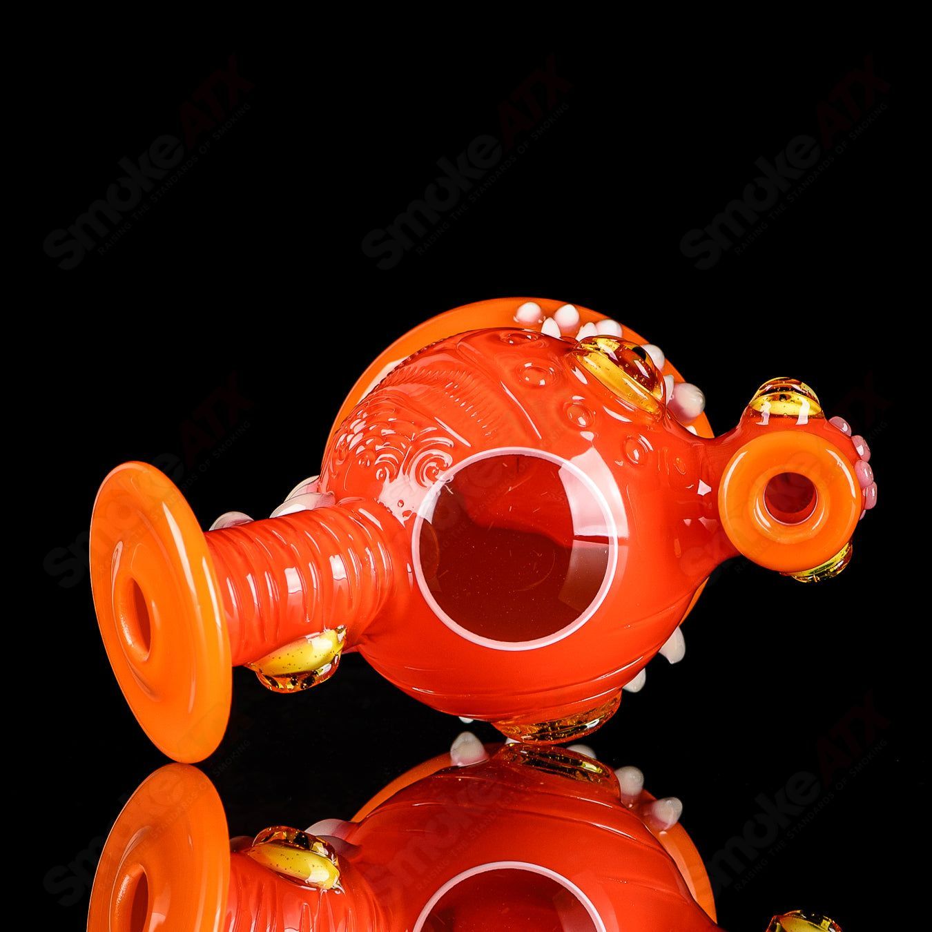 Orange Crayon Orb Rig by SALT & JAG, a colorful glass concentrate rig with a vibrant orange orb design and intricate glasswork.