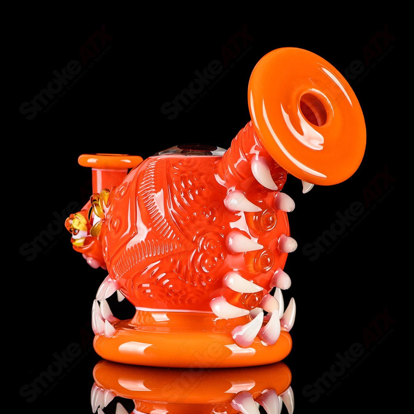 Orange Crayon Orb Rig by SALT & JAG, a colorful heady glass concentrate rig with an orb-shaped design for dabbing.