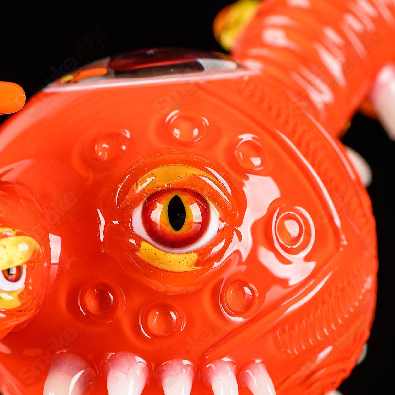 Orange Crayon Orb Rig by SALT & JAG, a colorful heady glass concentrate rig with vibrant orange and clear glass details.