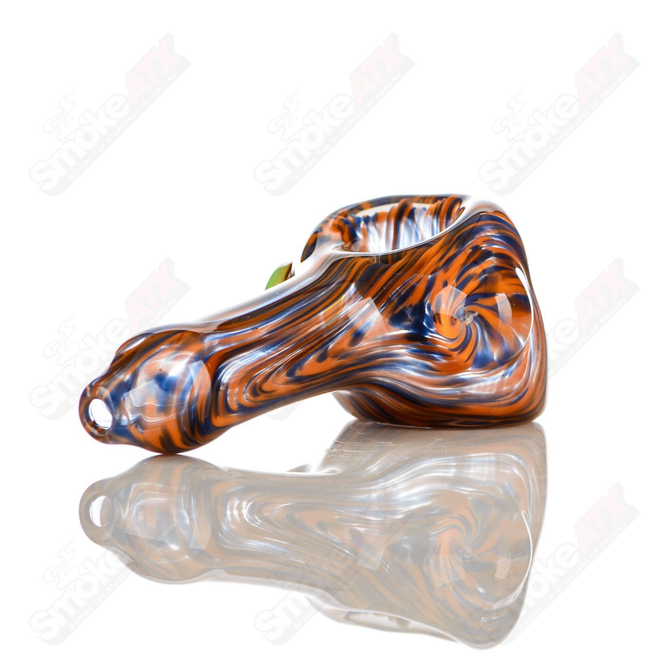 Handcrafted orange and purple worked glass spoon pipe with slyme accent and signed JMK Glass logo.