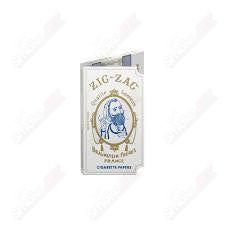 Original white Zig Zag rolling papers for rolling tobacco or herbs, thin and lightweight for smooth smoking experience.