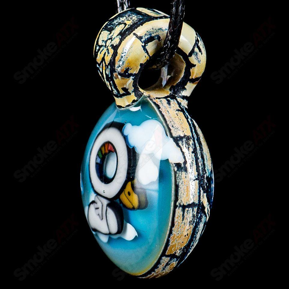 Calmbo x Trevy Metal Heady Glass pendant with intricate colorful glass design on a silver chain.