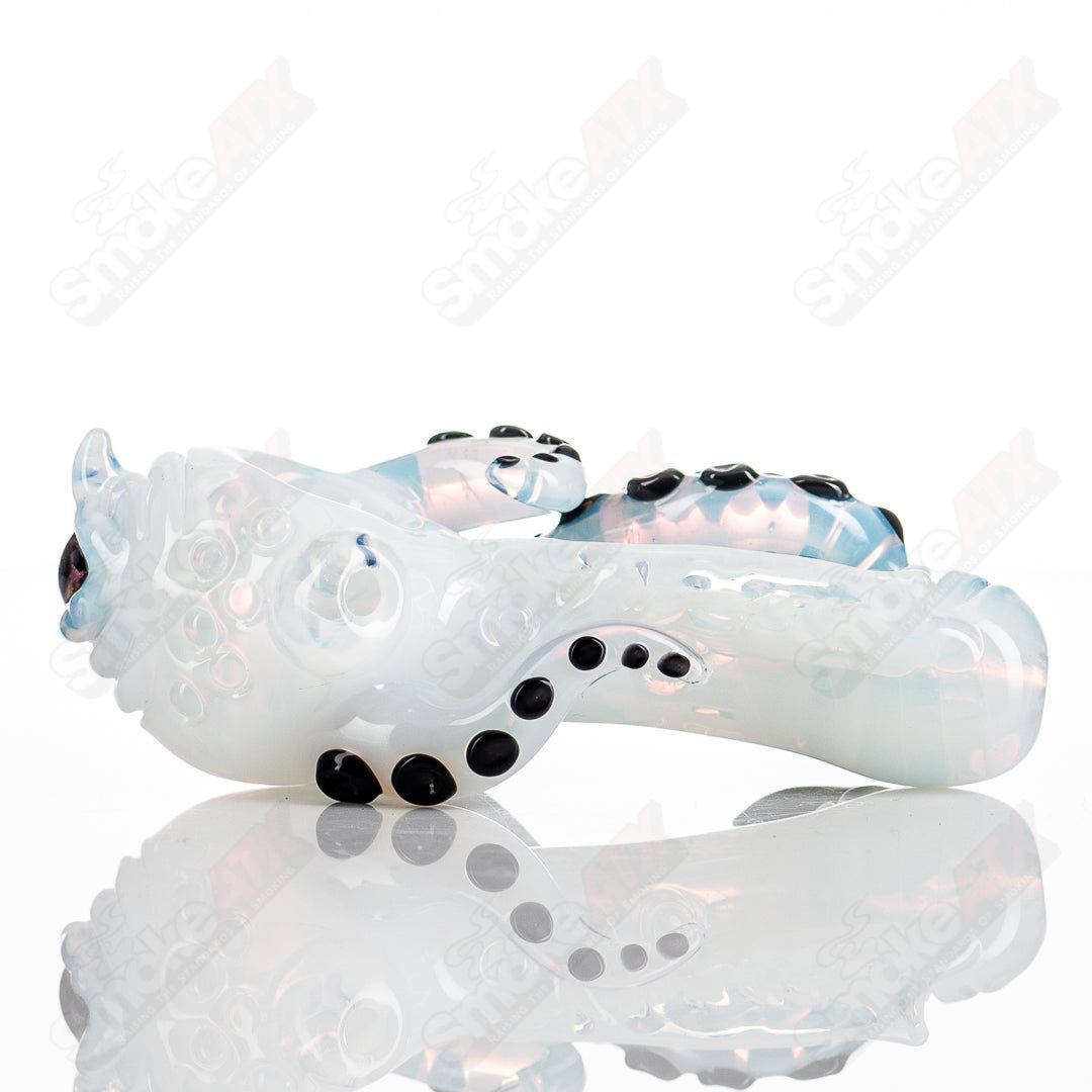 Hand pipe from Mako Glass's Seamonster Spoon series, featuring colorful, intricate heady glass design with a curved bowl.