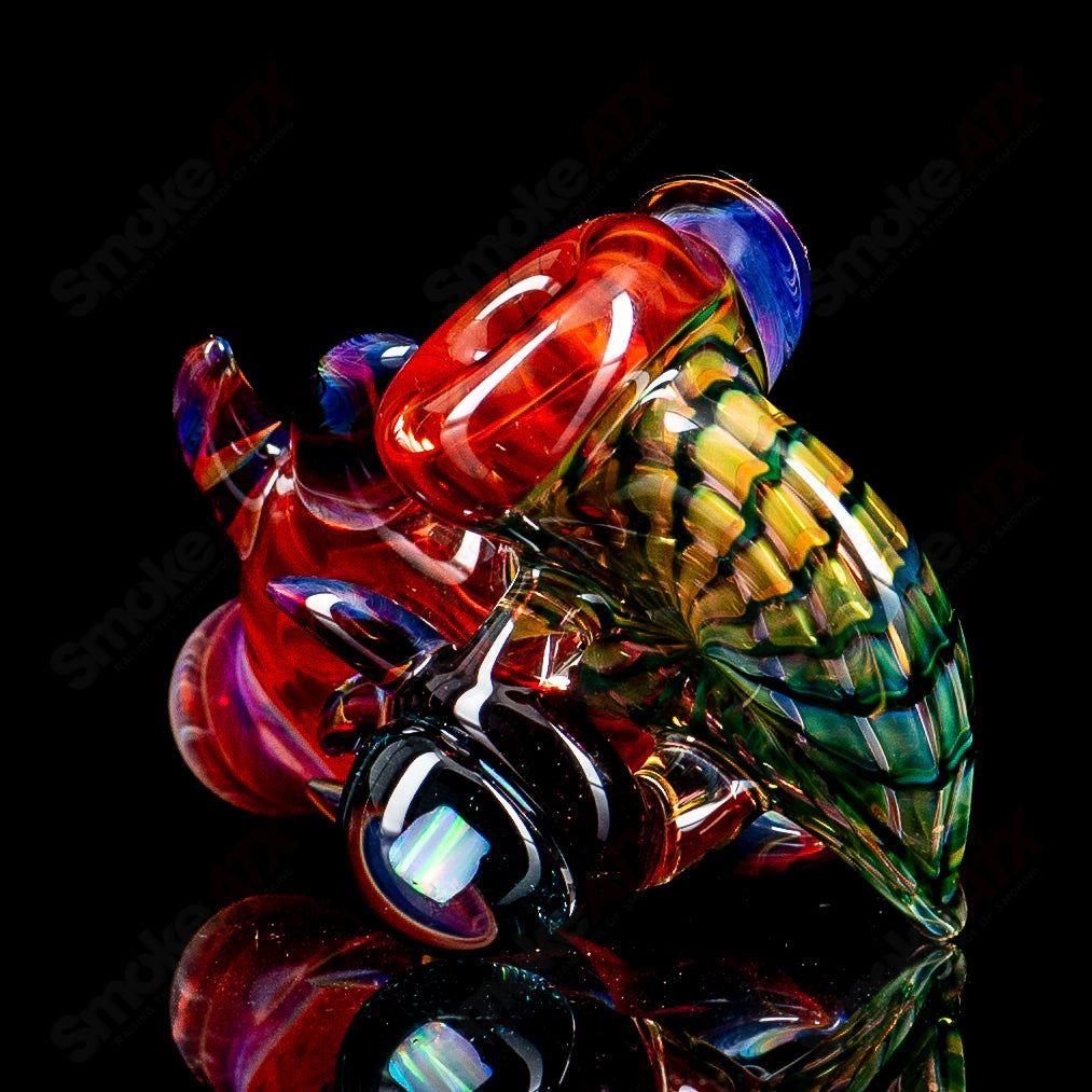 Dosh Glass Piranha hand pipe featuring detailed piranha design, crafted from colorful heady glass for smoking use