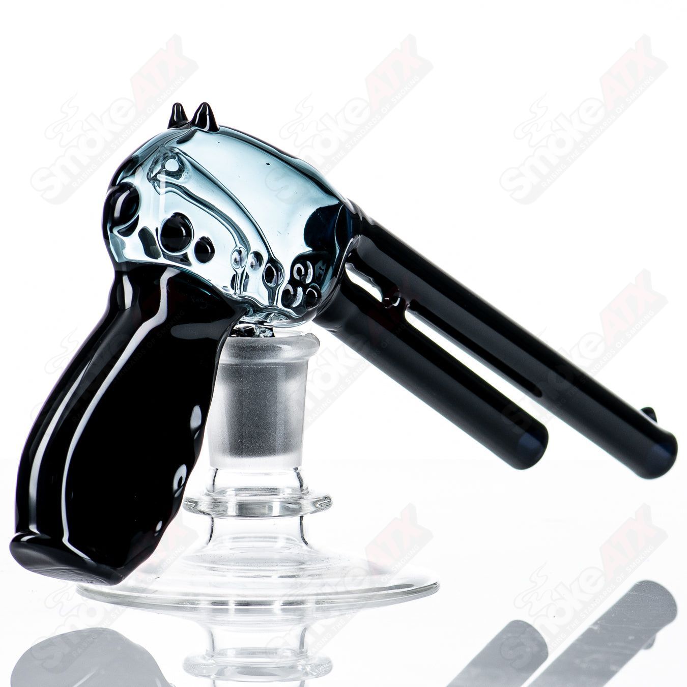 Heady glass pistol rig by JMass for concentrates, featuring a detailed pistol design with colorful glass accents.
