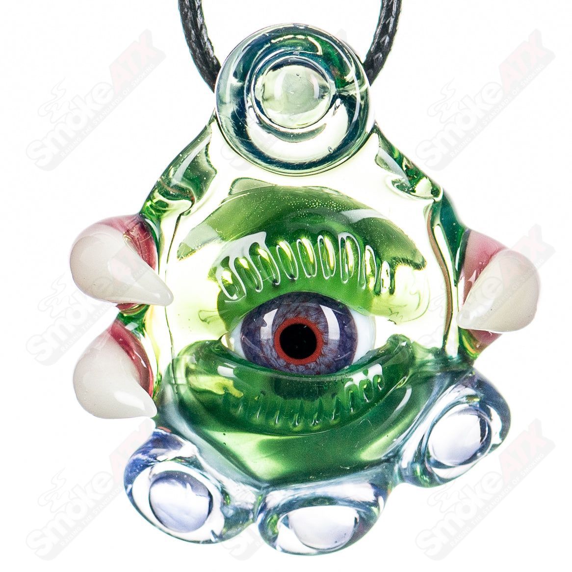 Neptunium Ion UV pendant by Salt Glass, a colorful heady glass pendant featuring a plantphibian design with UV-reactive elements.