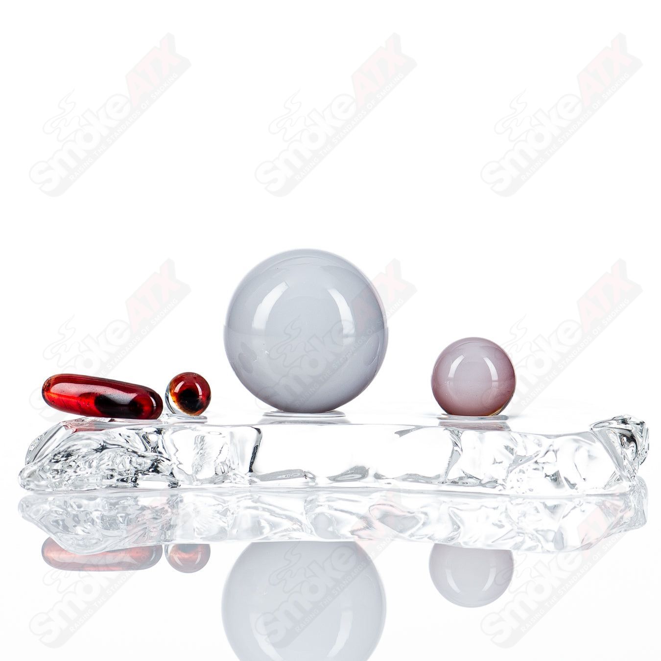 Pomegranate Eye Slurper Set by Indo Glass featuring colorful glass accessories with pomegranate and eye designs.