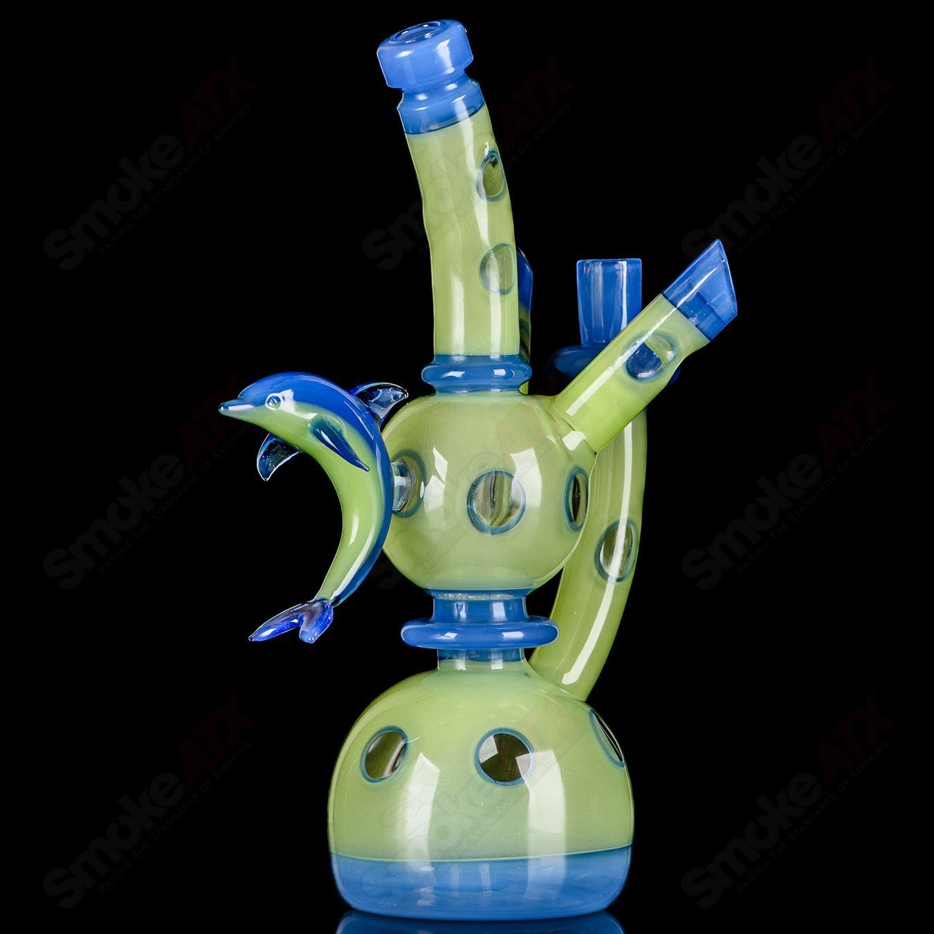 RAM Porthole Xhalerator Robert Mickelsen glass concentrate rig with intricate porthole design and vibrant colors.