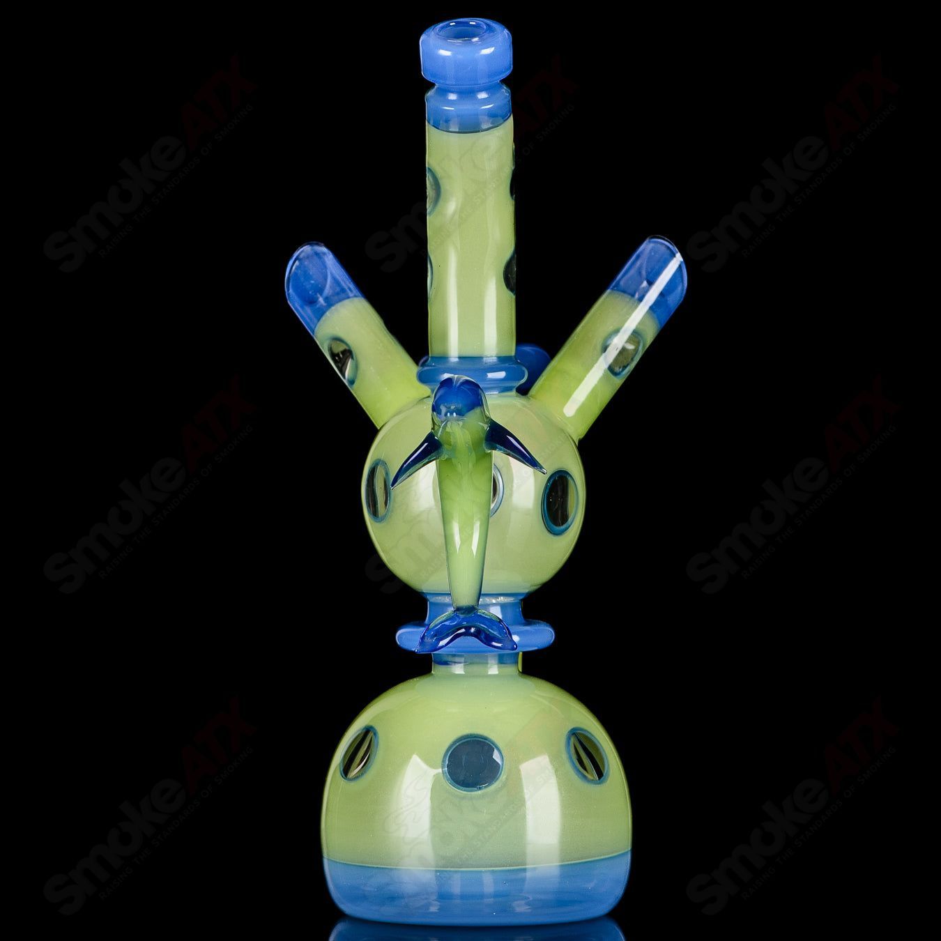 Colorful Porthole Xhalerator RAM Robert Mickelsen glass concentrate rig with intricate glass art and a round porthole design.