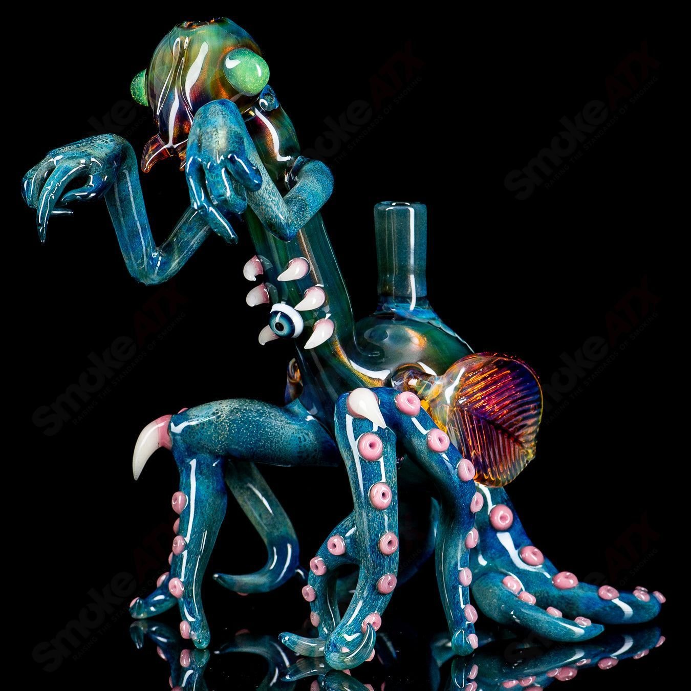 Salt Glass Praying Mantis Rig Burtoni X SALT, heady glass concentrate rig with intricate mantis design and vibrant colors.