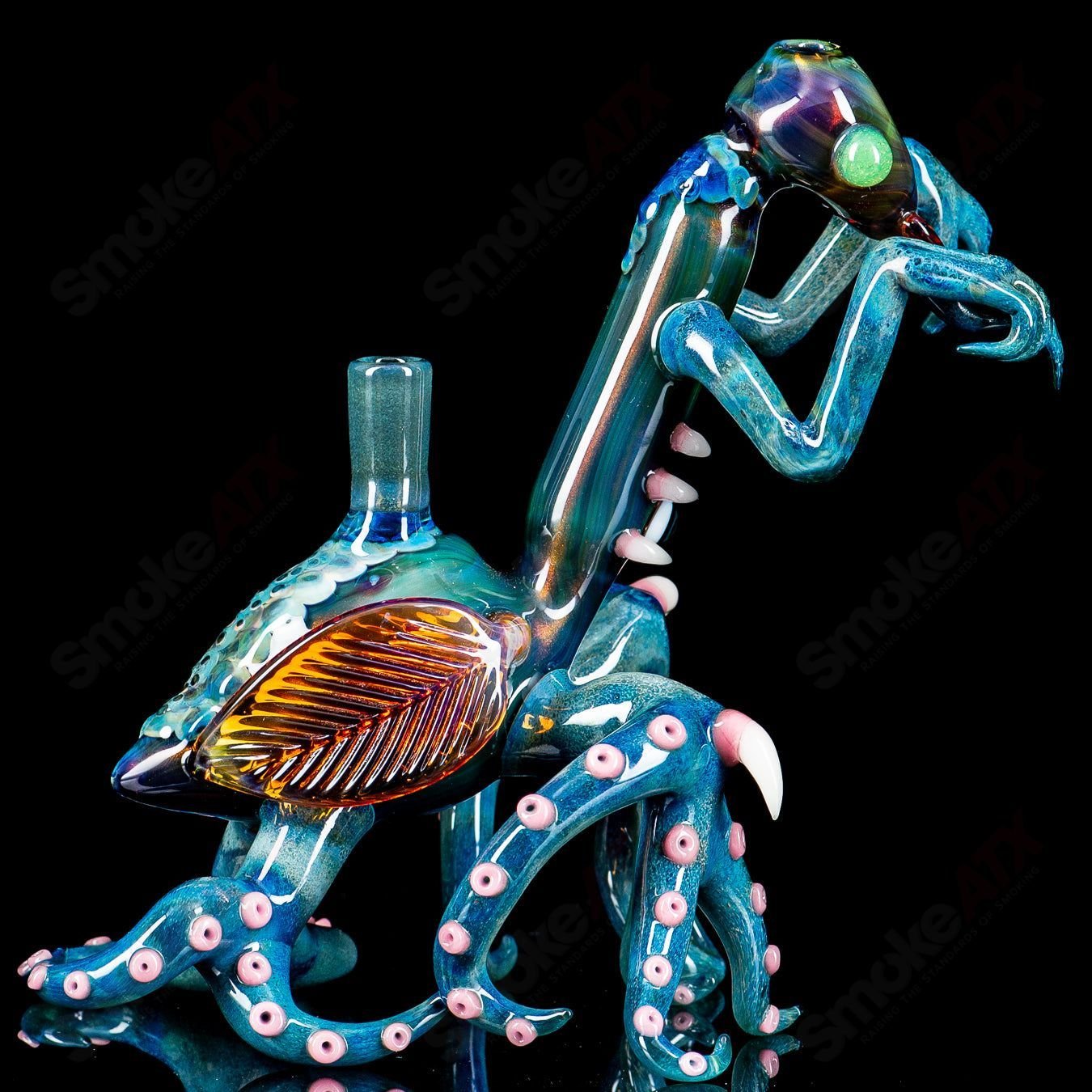 Praying Mantis Rig Burtoni x SALT heady glass concentrate rig with intricate design and clear glass detailing.