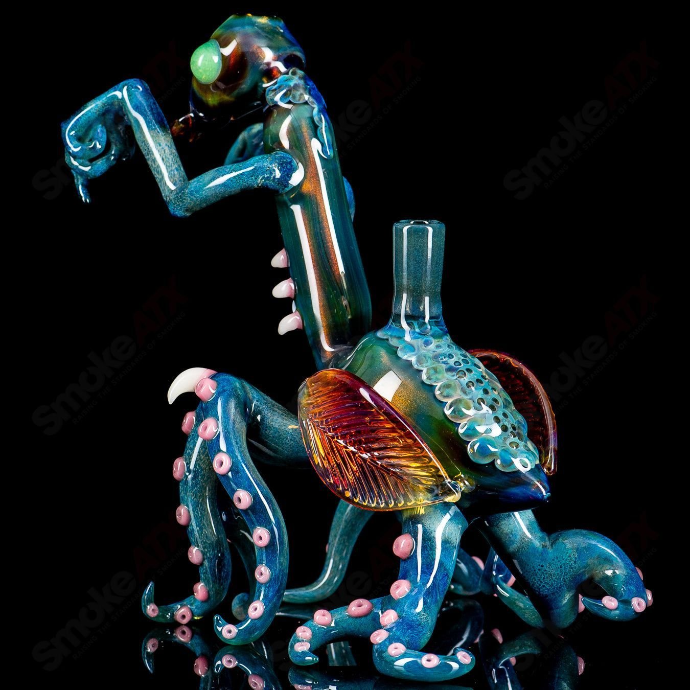 Salt Glass Praying Mantis Rig Burtoni x SALT heady glass concentrate rig with intricate praying mantis design.