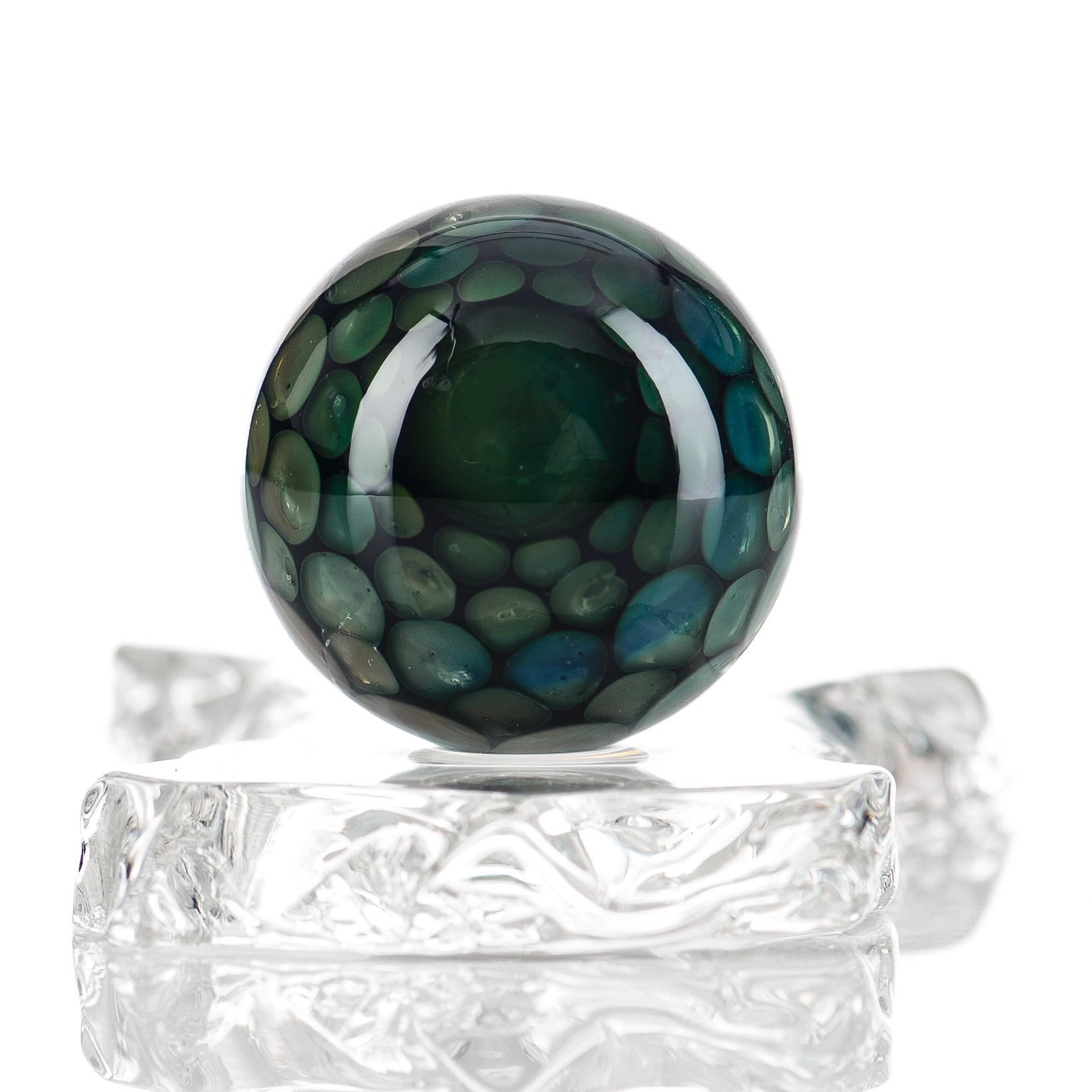 Clear marble glass globe from Flex Glass, featuring a smooth, rounded surface and a glossy marble finish.
