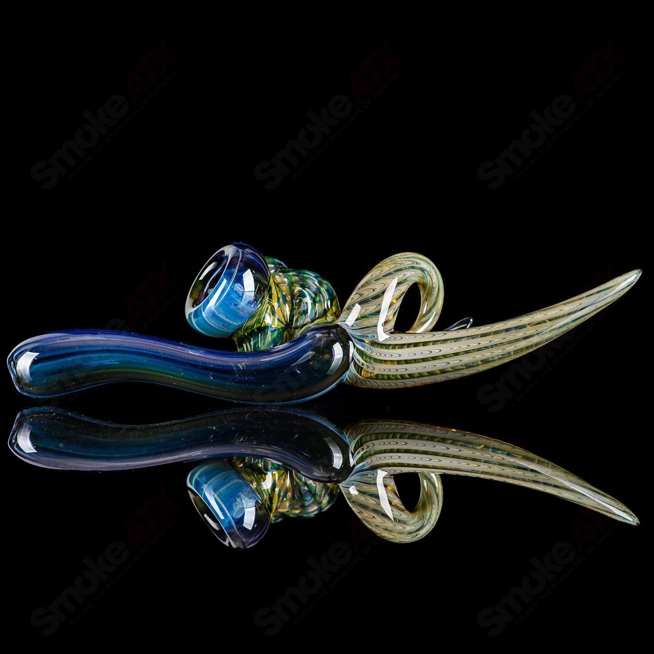 Dosh Glass Raptor hand pipe featuring a detailed raptor design, made of heady glass for smooth smoking experience.