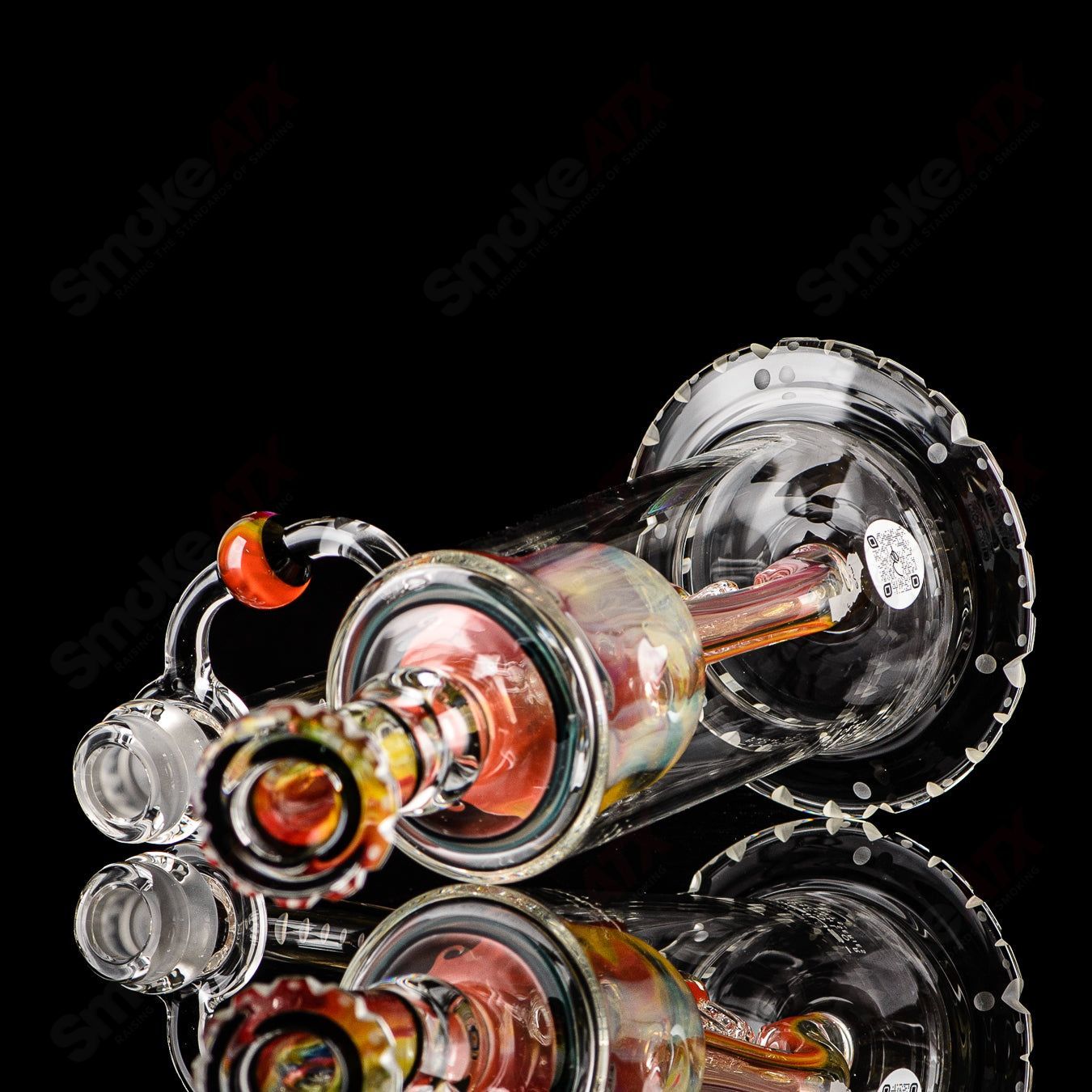 Mobius Recurve Accent Series glass concentrate rig with intricate design and clear glass construction.