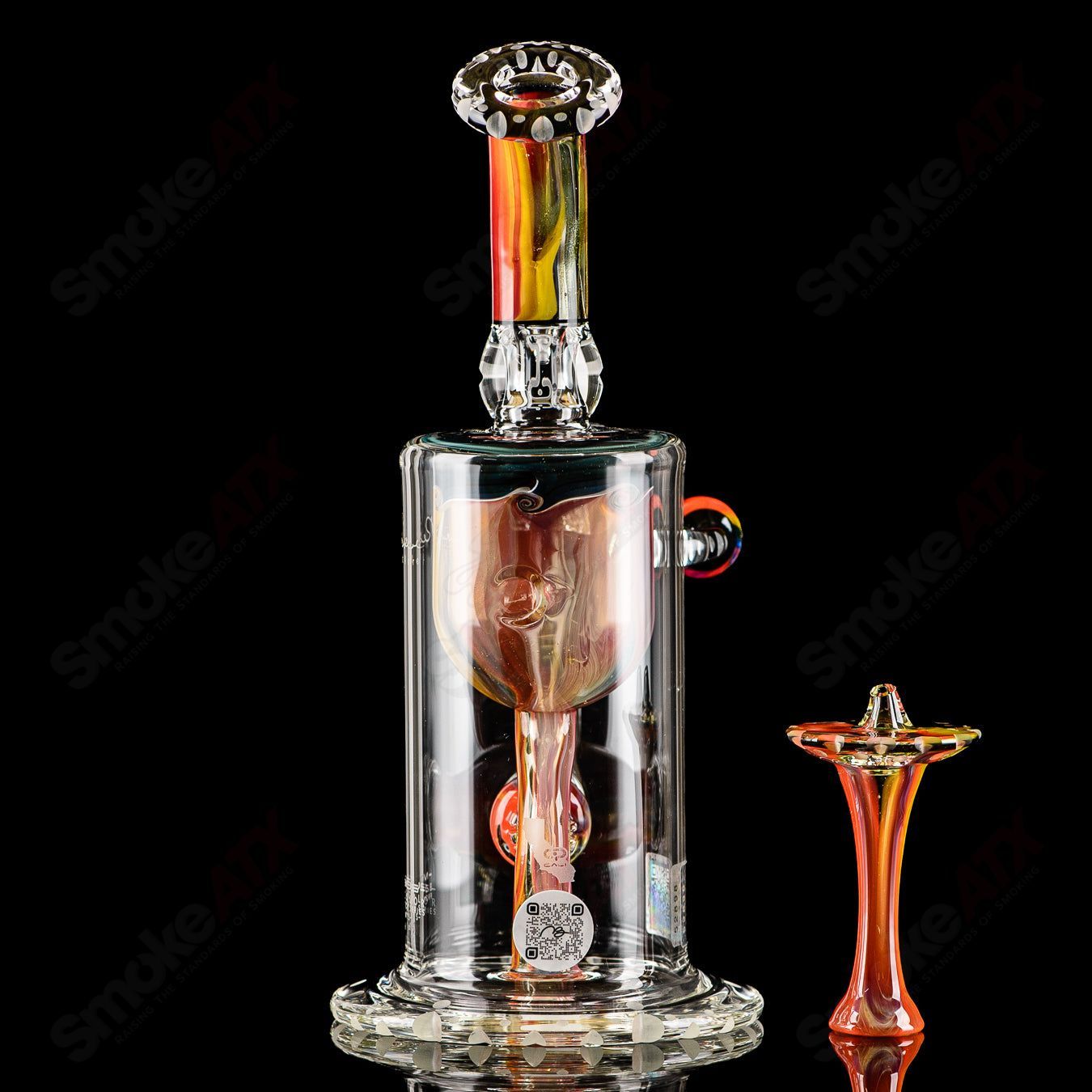 Mobius Recurve Accent Series glass concentrate rig with colorful design and intricate glasswork, designed for concentrate use.