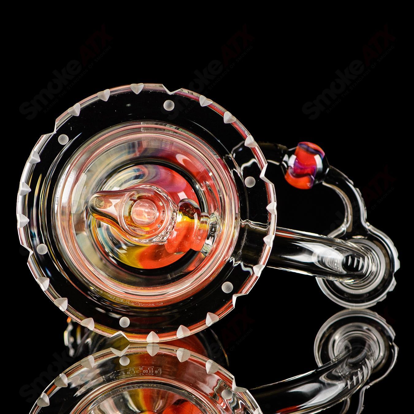 Mobius Recurve Accent Series glass concentrate rig with intricate design and clear construction, ideal for concentrates.