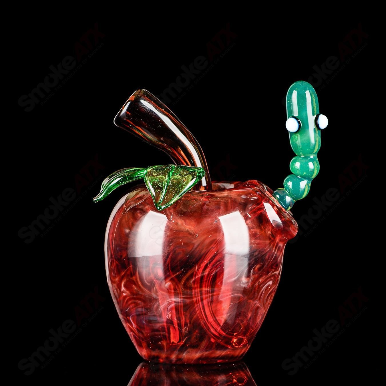 Red Apple Rig with Worm Dabber Pouch Glass, colorful heady glass concentrate rig featuring a vibrant red apple design and matching dabber.