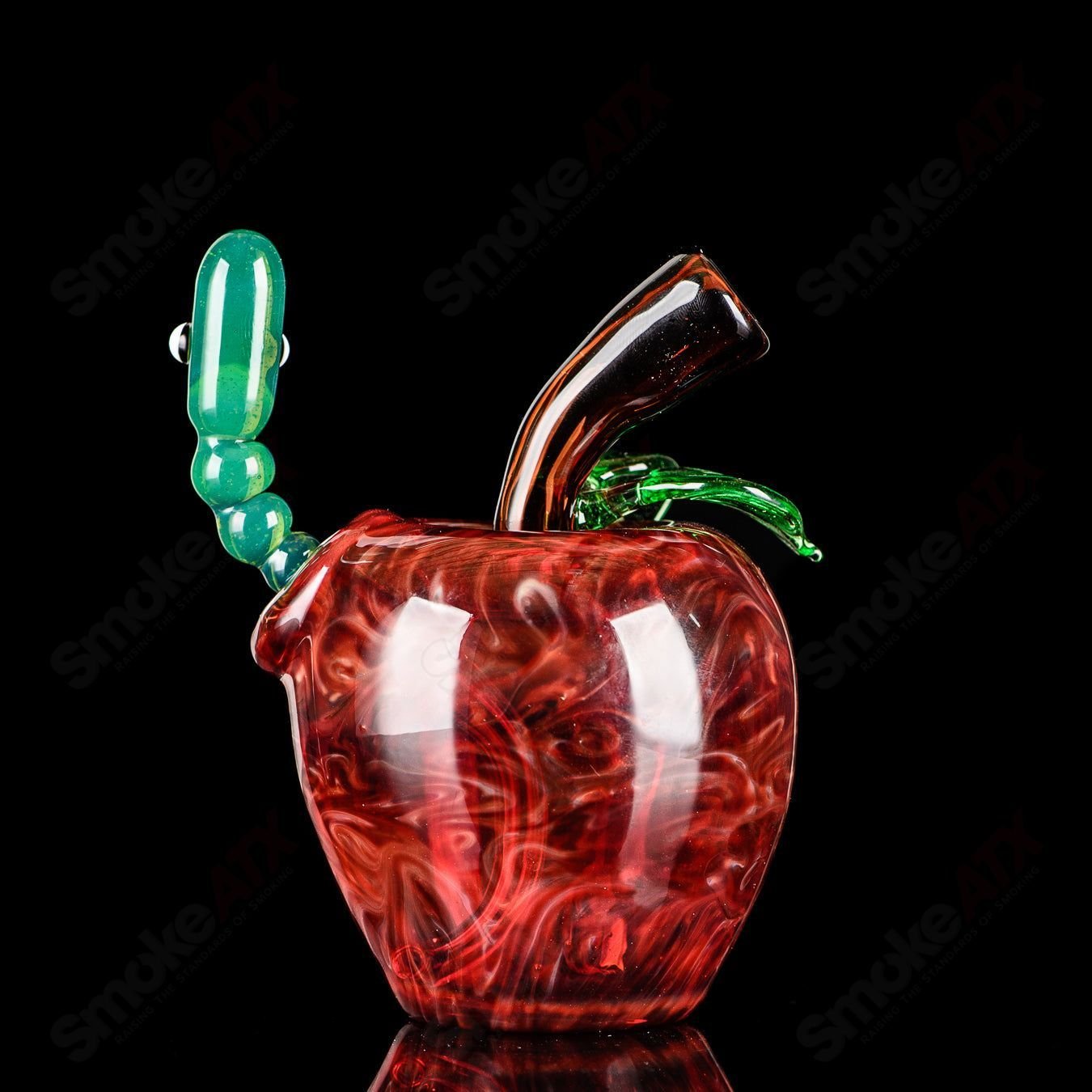 Red apple-shaped rig with worm dabber pouch, made of glass, part of Pouch Glass's heady concentrate rigs collection.