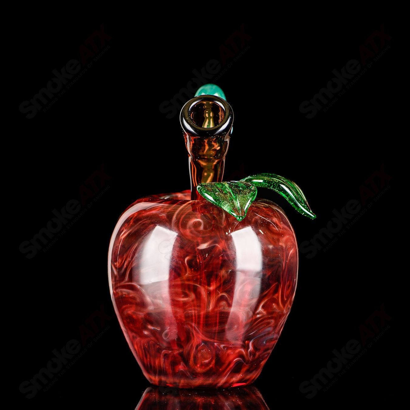 Red apple-shaped rig with a worm dabber pouch from Pouch Glass, designed for concentrate use in heady glass style.