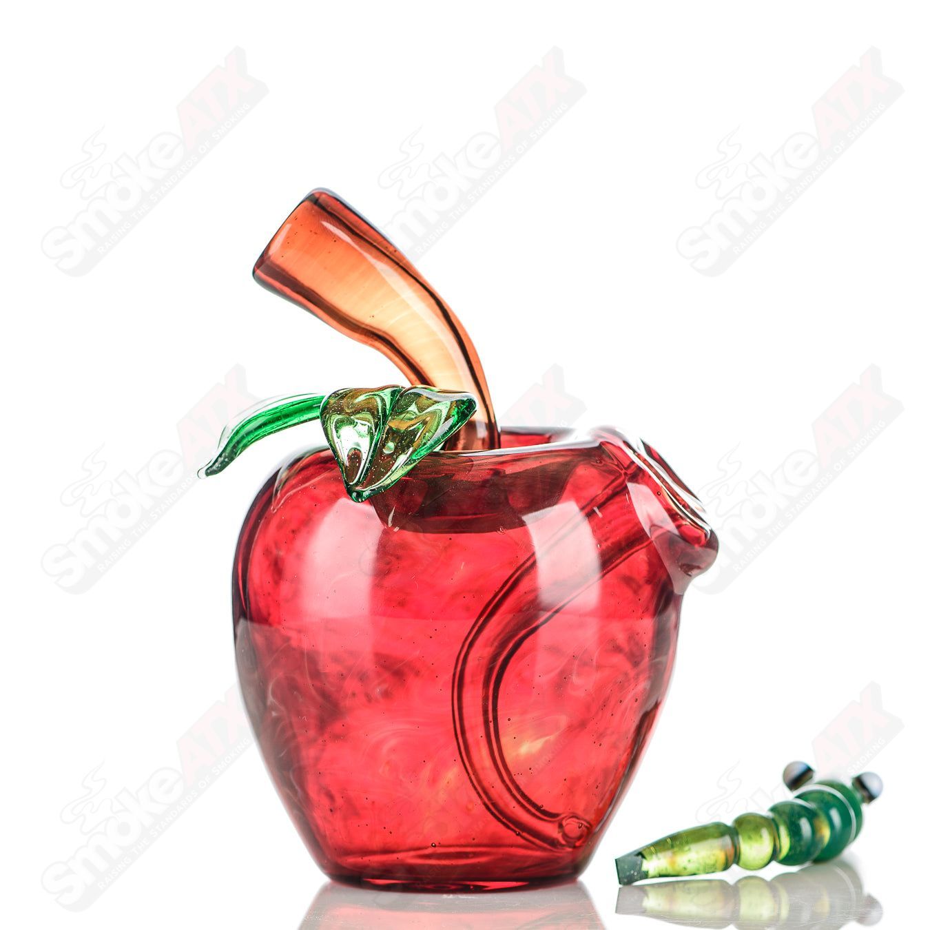 Red apple-shaped rig with worm dabber pouch from Pouch Glass, featuring colorful glass craftsmanship for concentrate use.