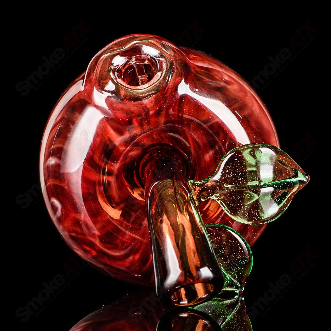 Red apple-shaped rig with worm dabber pouch, made by Pouch Glass, featuring colorful glass design and concentrate rig details.