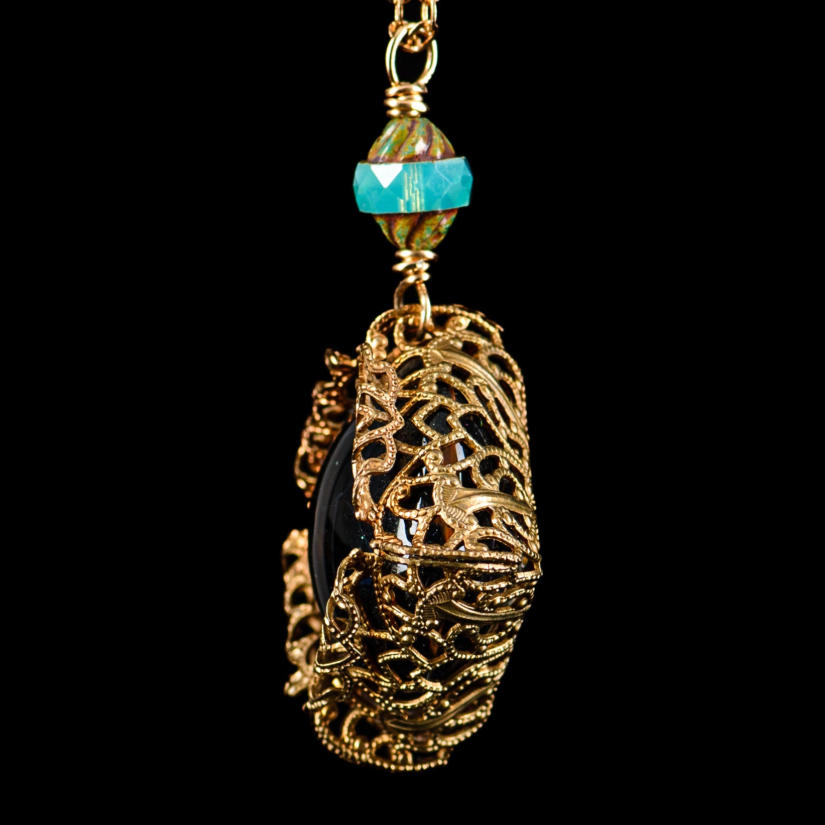 Glass UV Dot Stack Brass Pendant Chain by Pake featuring a stylish glass pendant with UV-reactive dots on a brass chain.