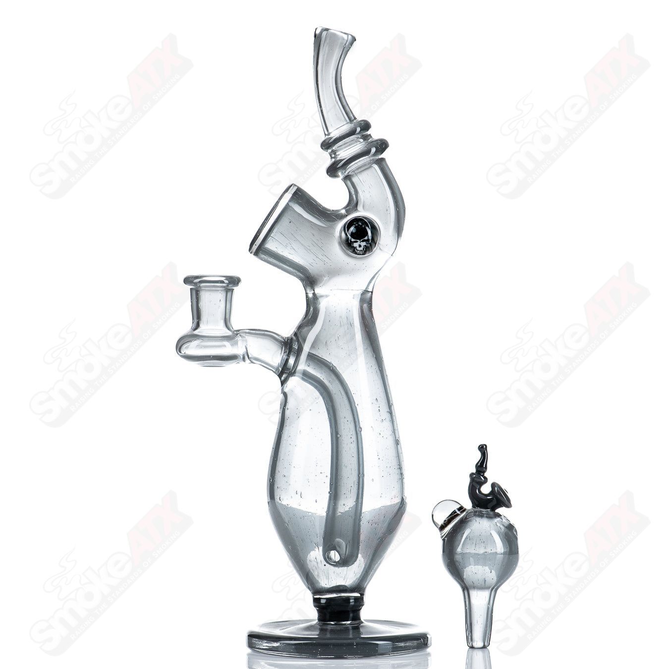 Sherlock-style glass concentrate rig with matching cap bottle by JMass, featuring intricate design and clear glass construction.
