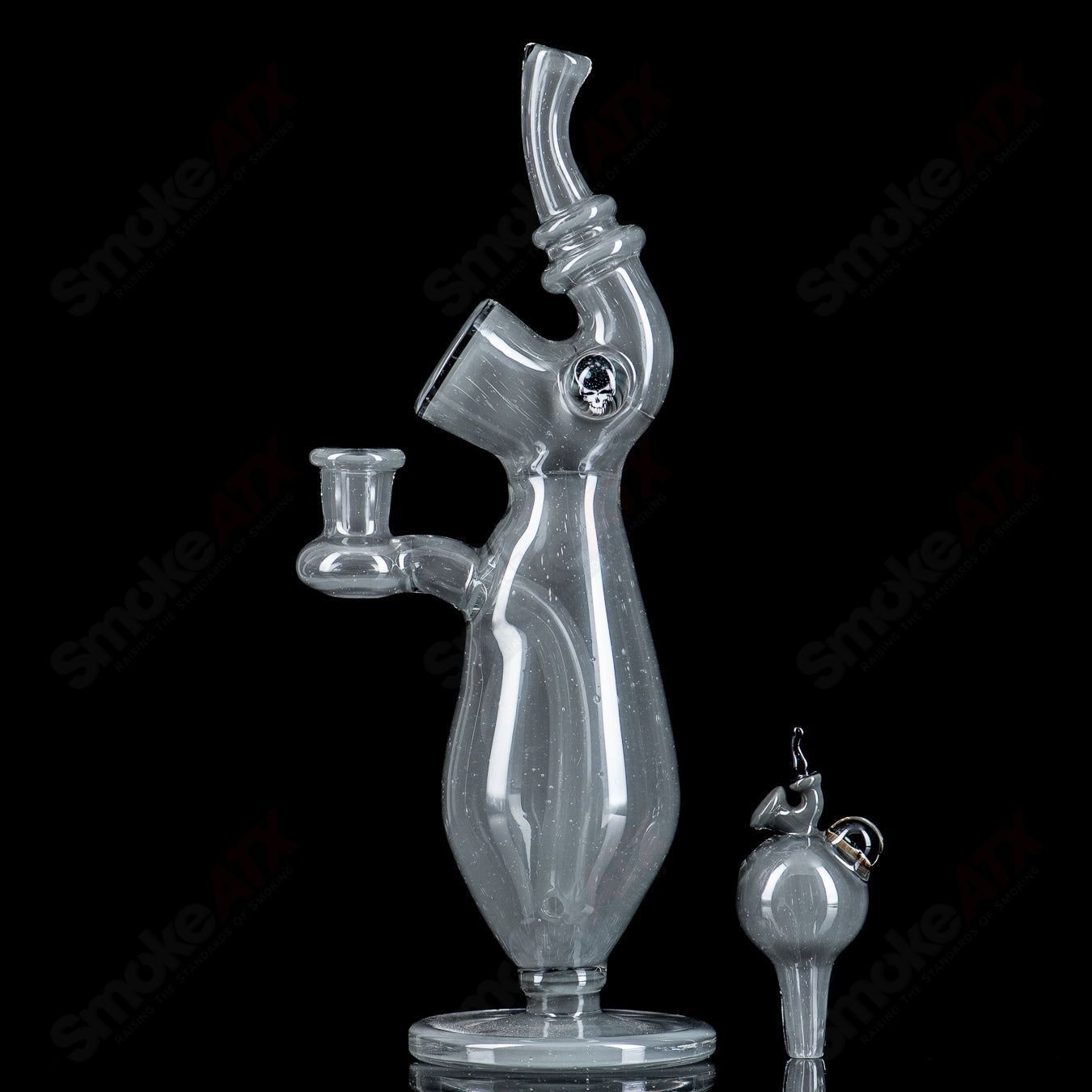 Sherlock-style heady glass concentrate rig with matching cap bottle by JMass, featuring intricate glasswork and detailed design.
