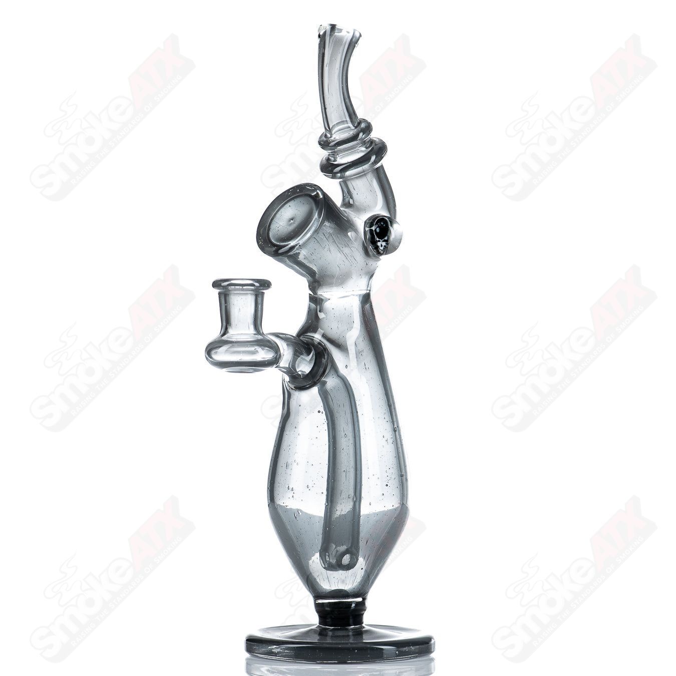 Clear Sherlock-style glass concentrate rig with matching cap by JMass, featuring intricate design and sturdy build.
