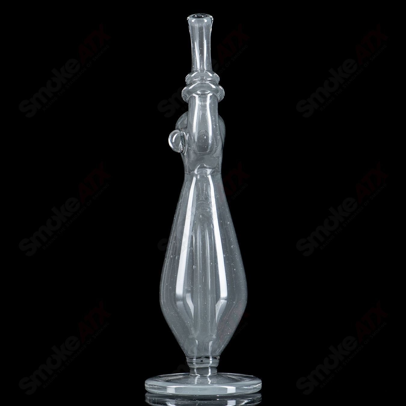 Sherlock W Matching Cap Bottle by JMass, a clear heady glass concentrate rig with a sleek design and matching cap.