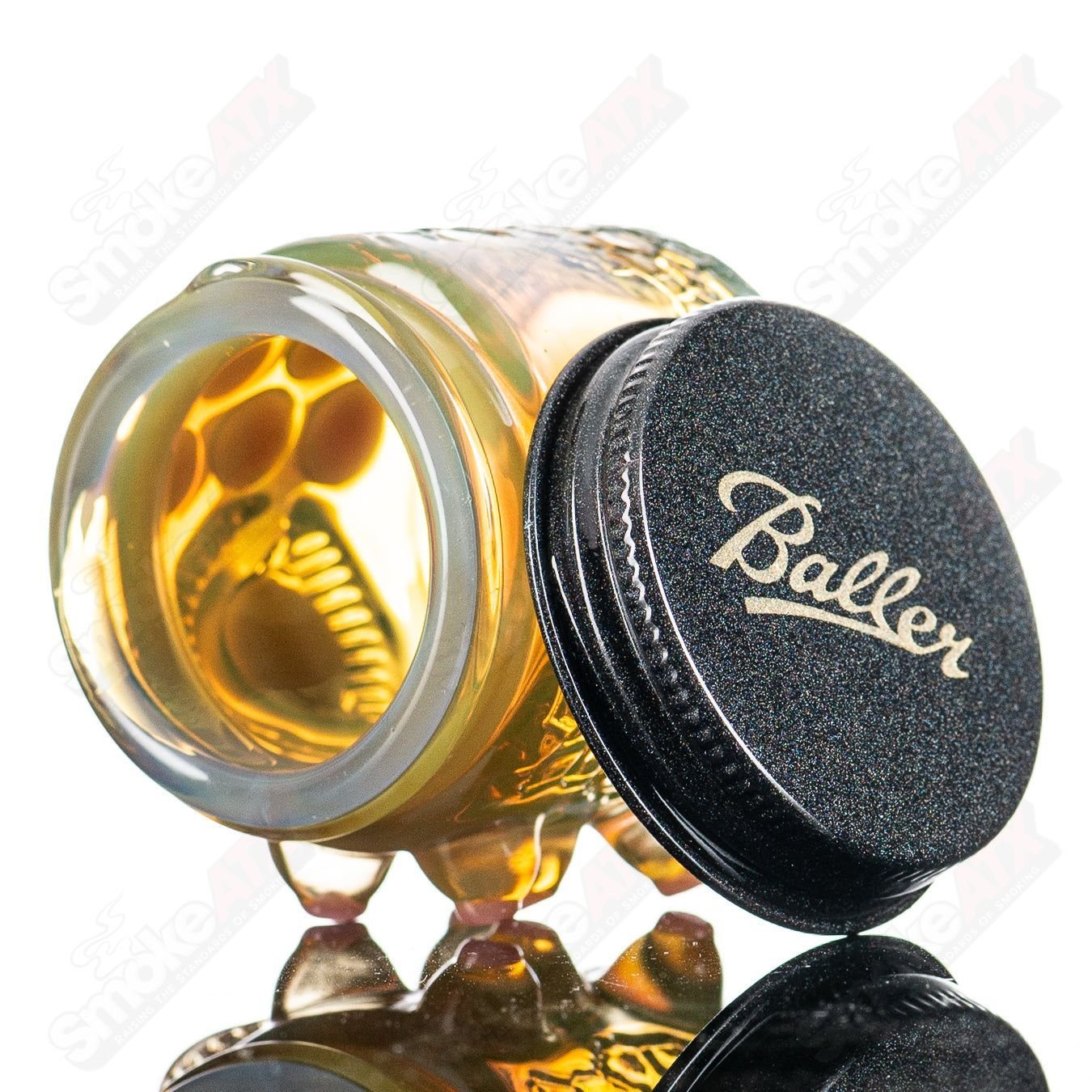 Silver Amber serum in a CFL glass Baller Jar X Salt container, showcasing a sleek, modern design for storage or display.